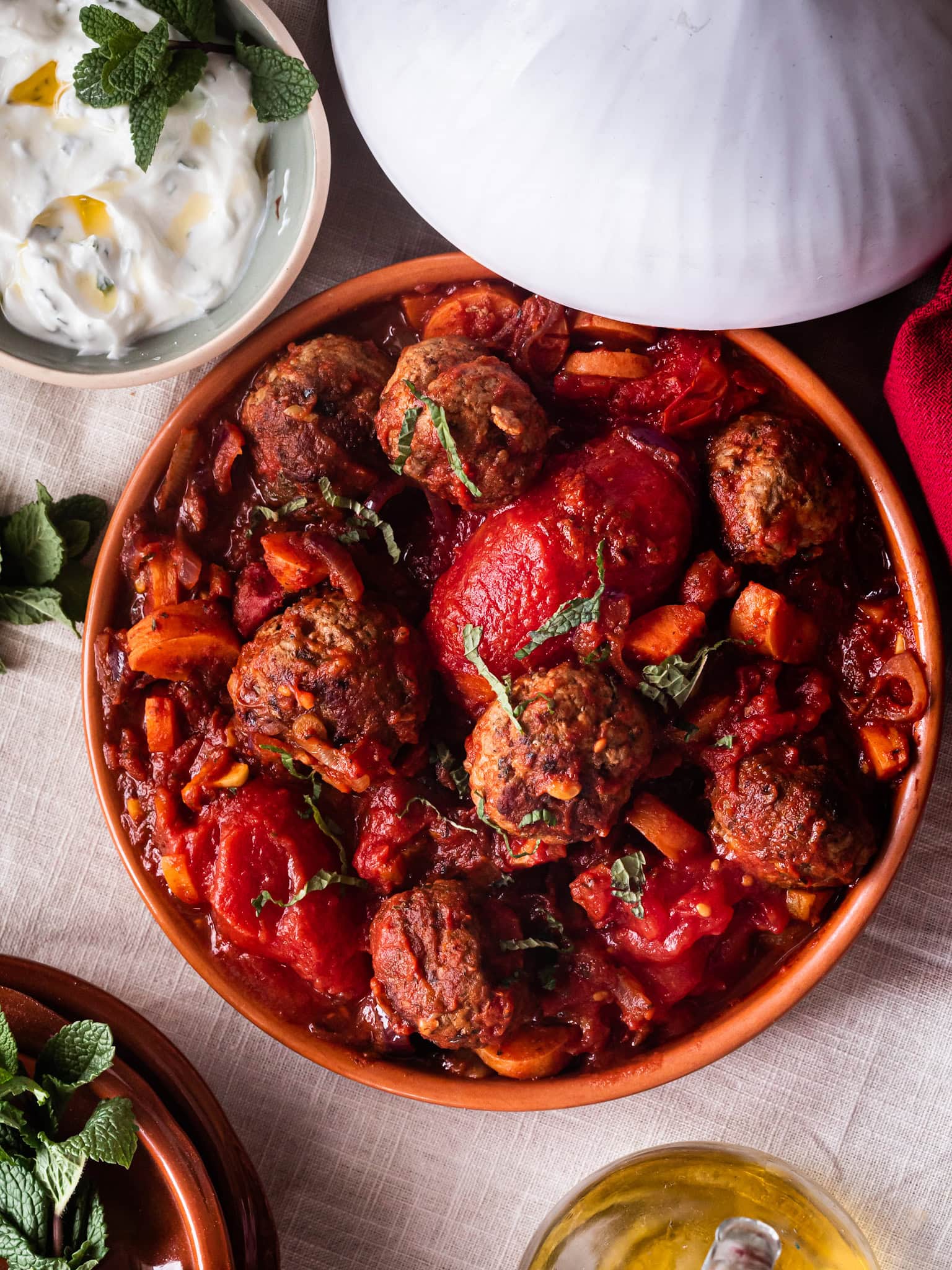 Tangy lamb meatball tagine with tomatoes, dates and apricots