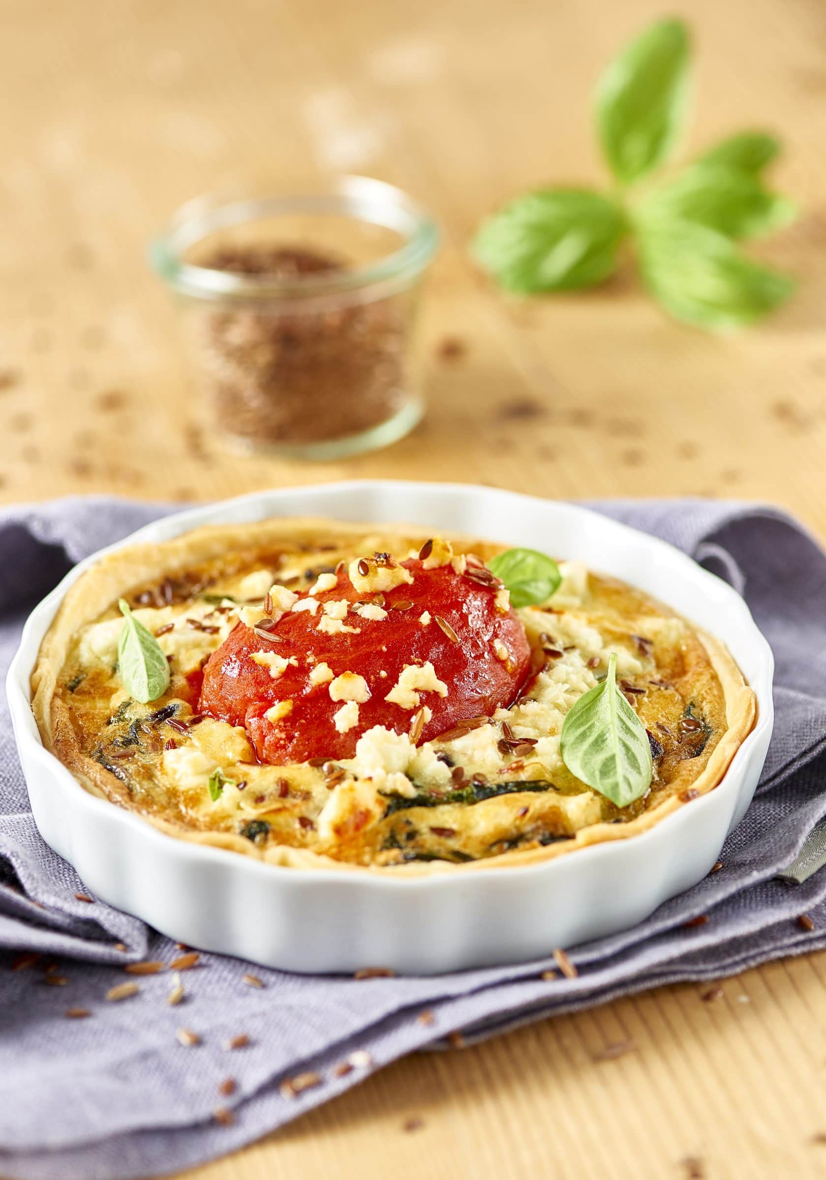 Feta and spinach quiche with peeled tomatoes